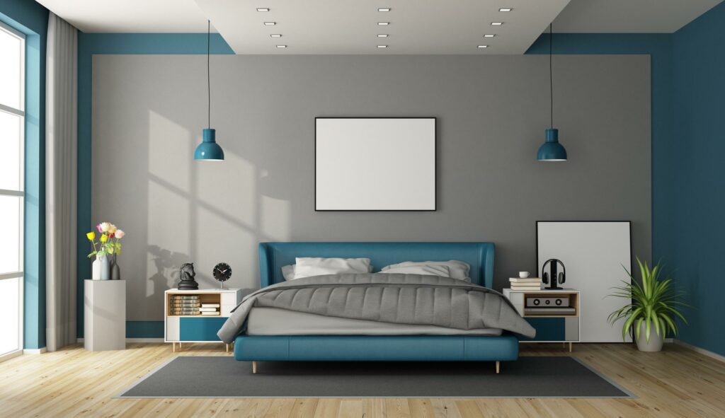 Habitación con colores grises y azules en Burriana.